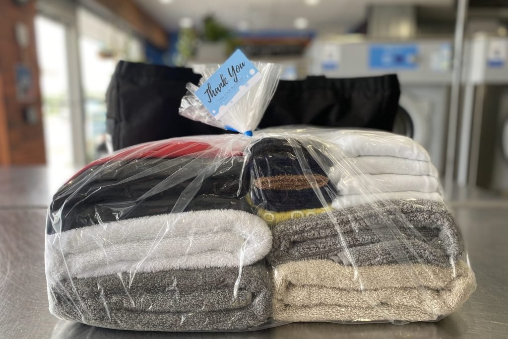 Fresh folded laundry from Tubs and Tumblers pickup/delivery service
