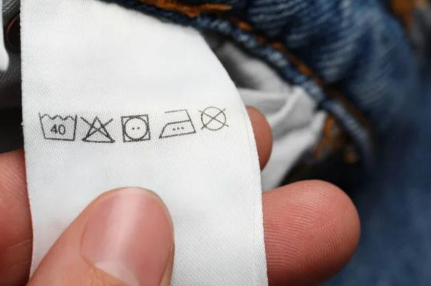 Clothing care label with washing and drying symbols