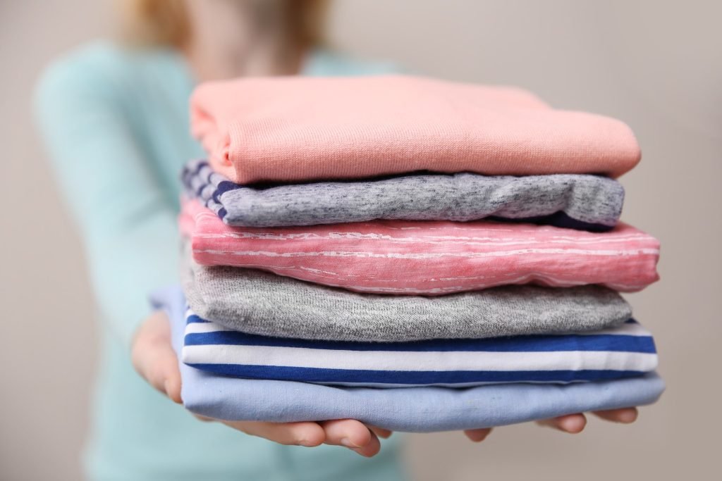 Commercial linens being folded at Tubs and Tumblers in Wayne