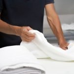 Fresh folded towels after professional commercial laundry service in Wayne MI