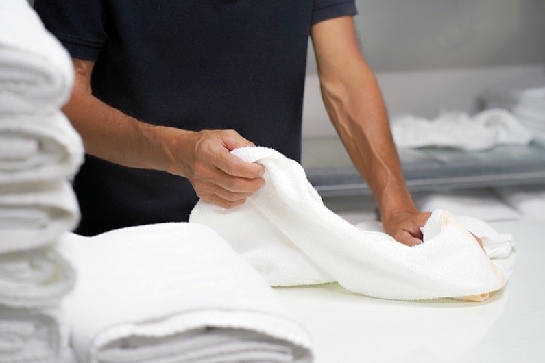 Fresh folded towels after professional commercial laundry service in Wayne MI